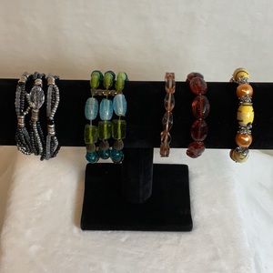 Elastic stretch bracelets. Set a five various colors, shapes and widths.